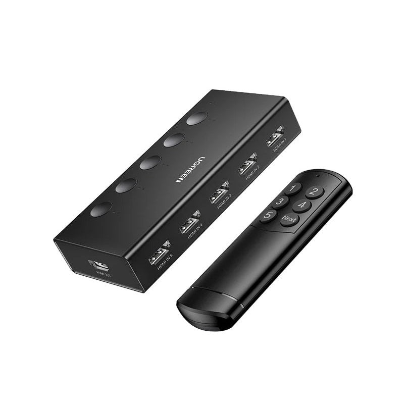 Black electronic device with remote control on a white background