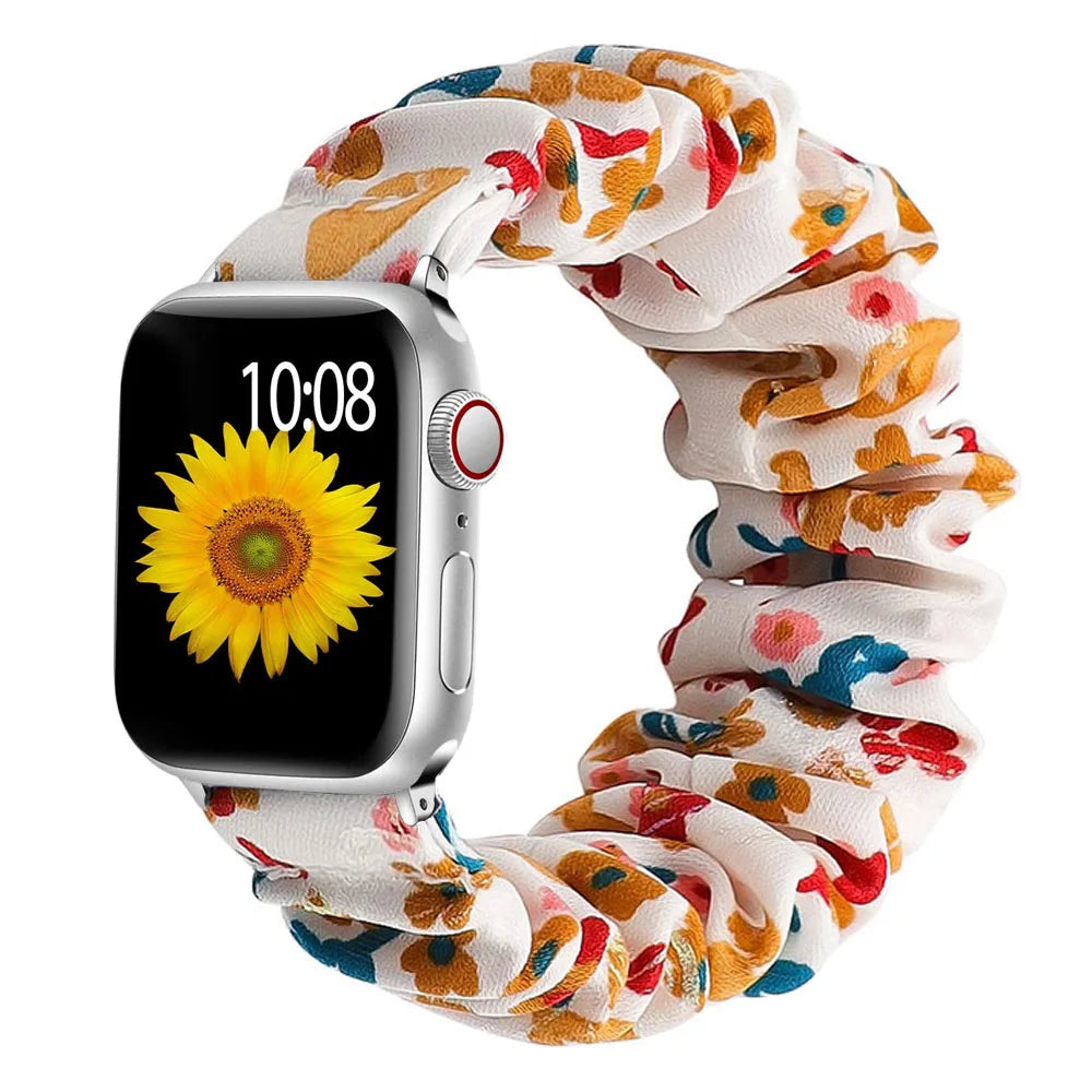 Smartwatch with a colorful floral scrunchie on a white background