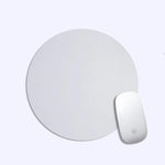 Round white mouse pad with a matching white mouse on a light gray background