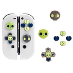 Set of alien-themed fidget spinners and accessories on a white background