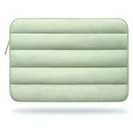 Light green quilted pouch with a zipper on a white background