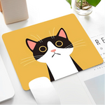 Mouse pad with a cat design on a desk