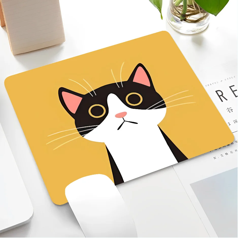Mouse pad with a cat design on a desk